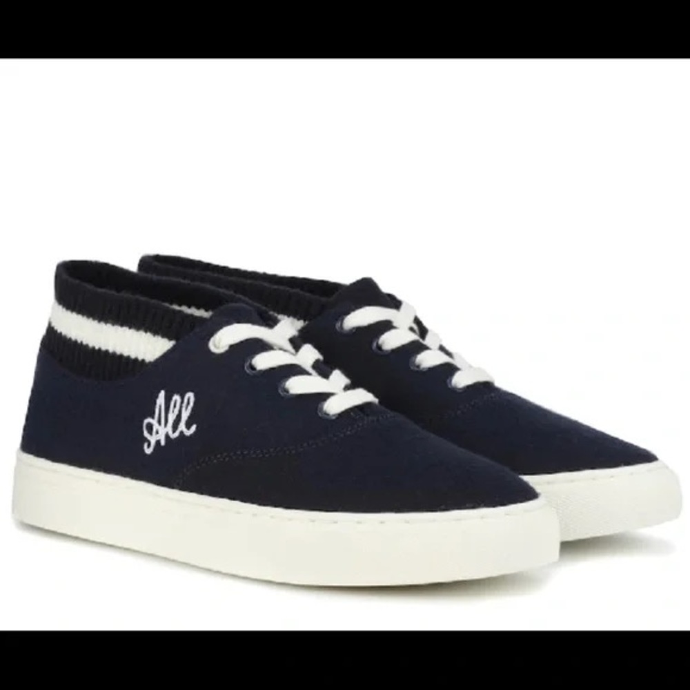 “Love All” mid top Tory Sport by Tory Burch sneakers.